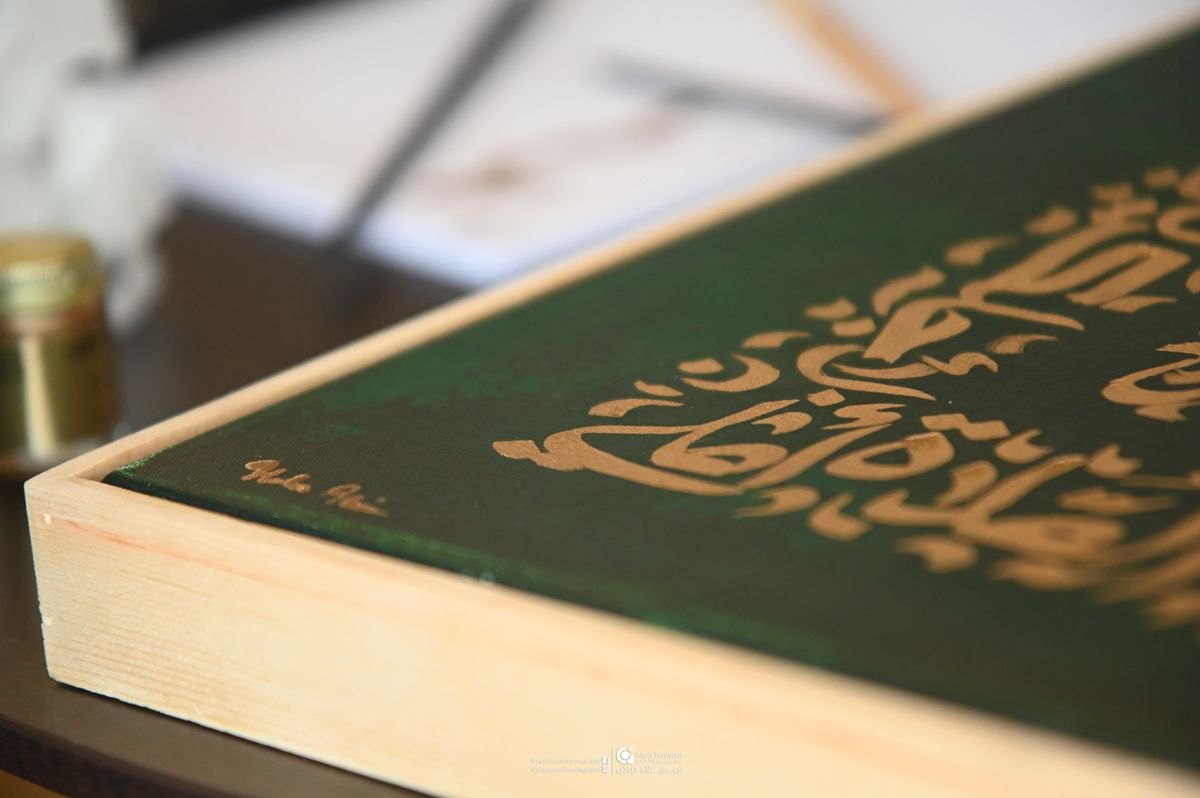 Studio detail — gold on green canvas, by Hala Ali