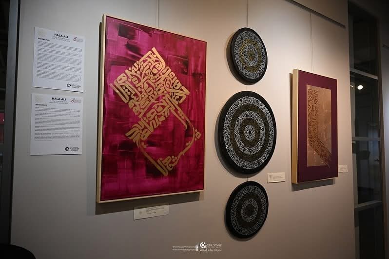 Gallery installation view — magenta painting and circular calligraphy works by Hala Ali
