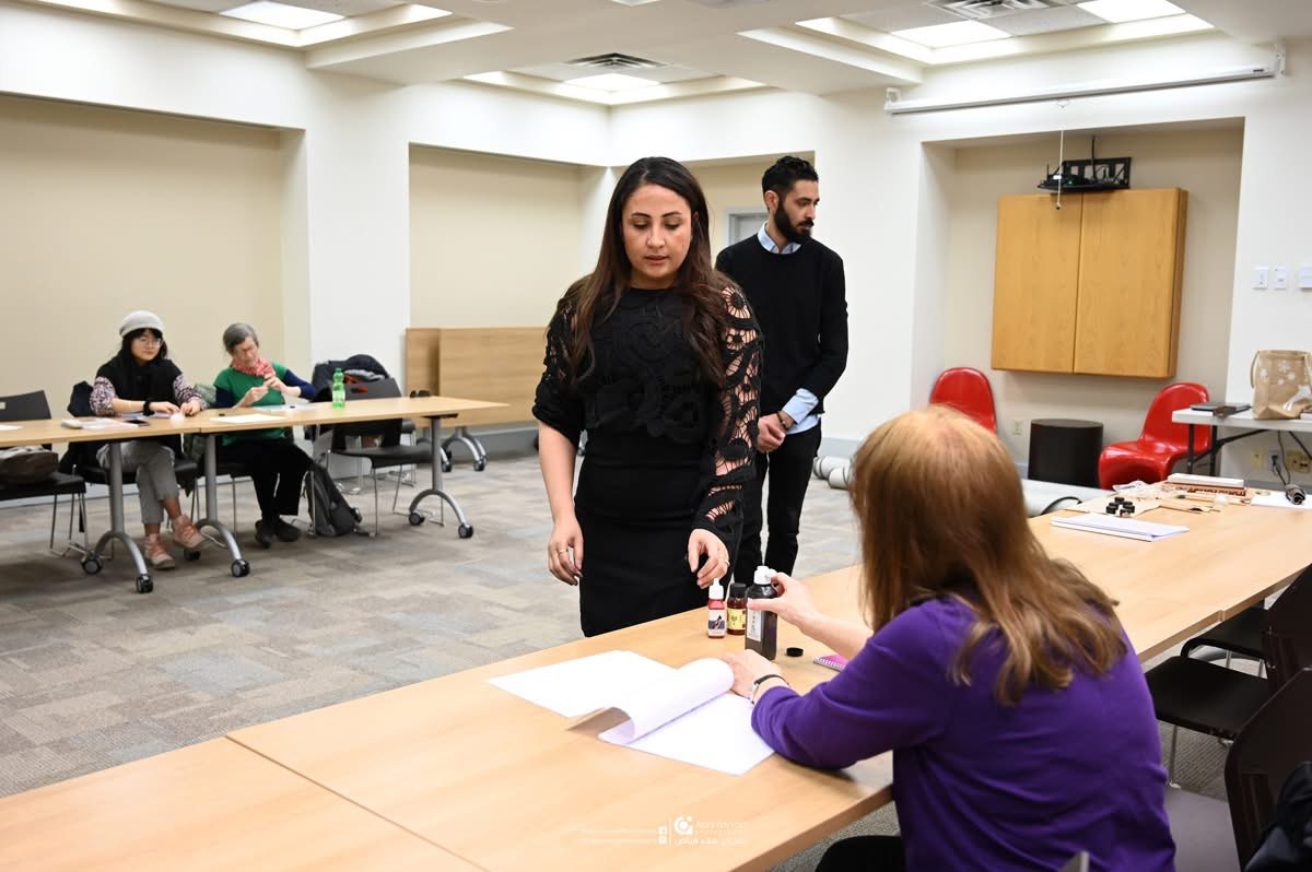 Hala Ali teaching a contemporary Arabic calligraphy workshop